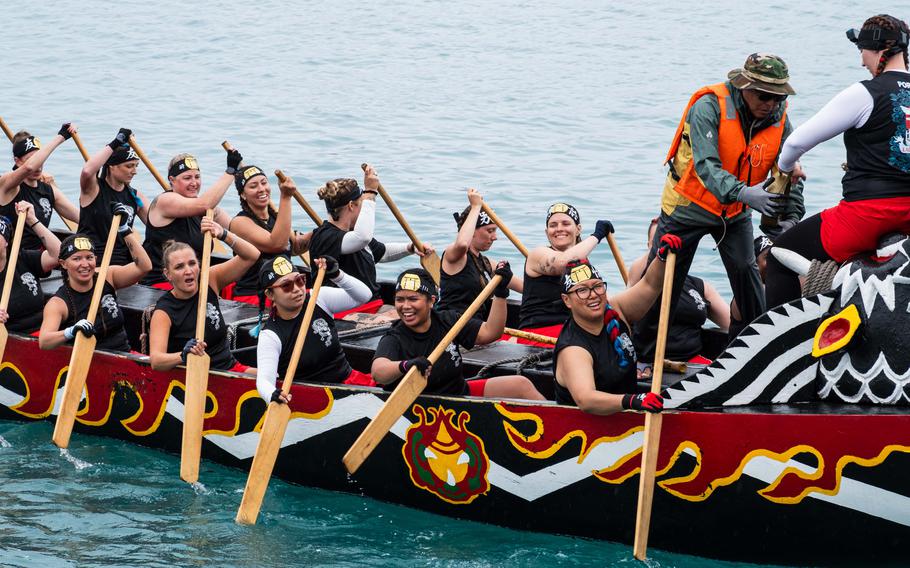 A team rowing a dragon boat.