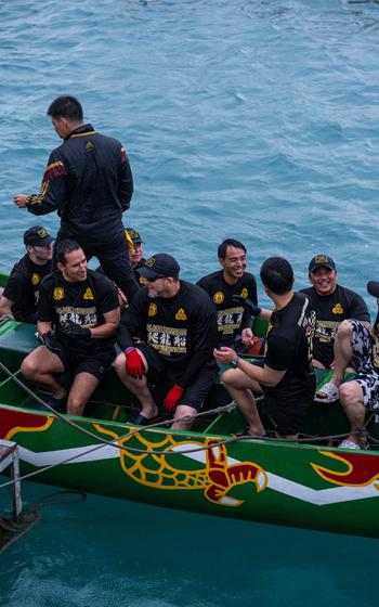 Men on a dragon boat.