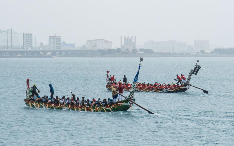 Two dragon boats racing.