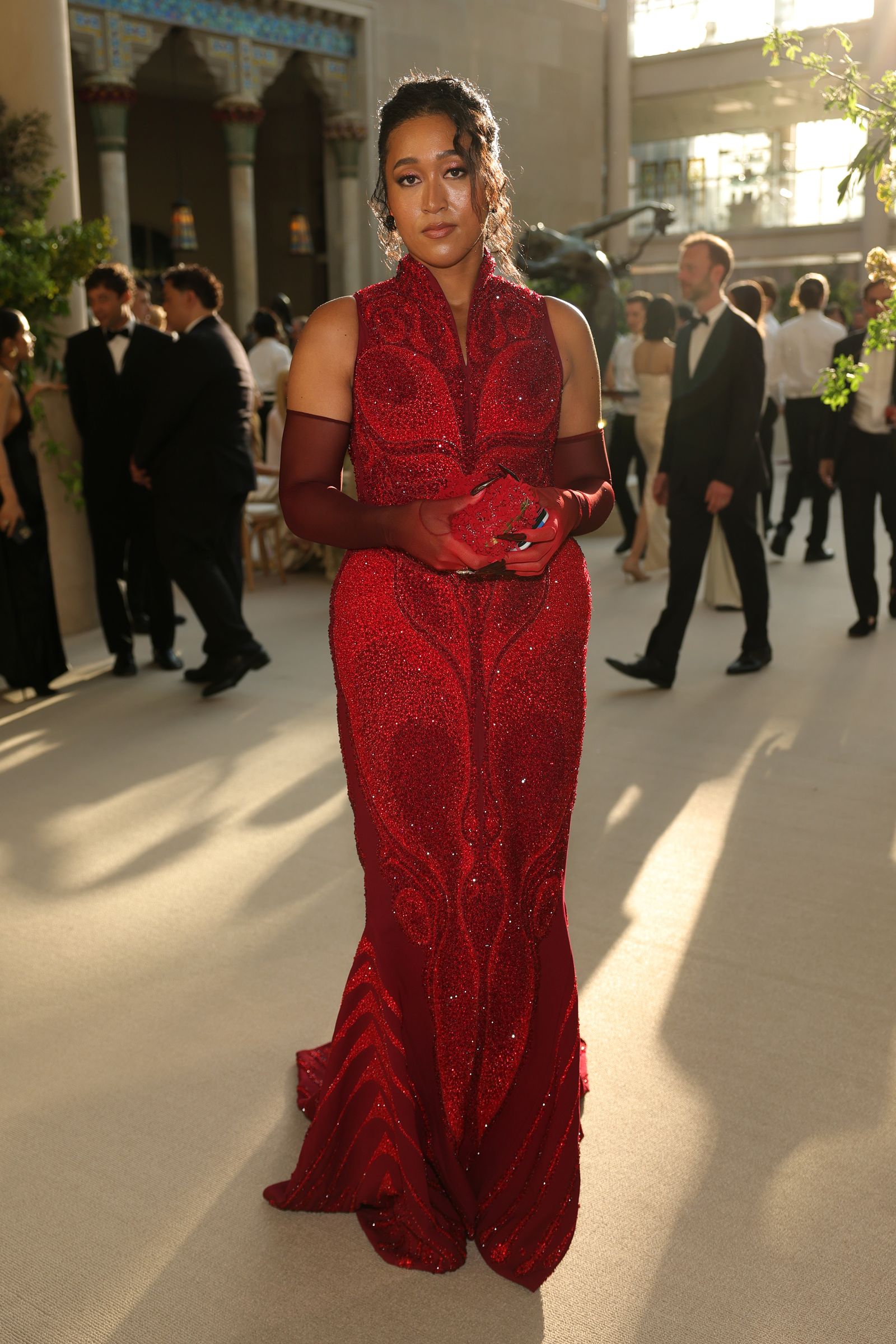 Image may contain Naomi Osaka Clothing Dress Formal Wear Fashion Person Gown Evening Dress Adult Wedding and Suit
