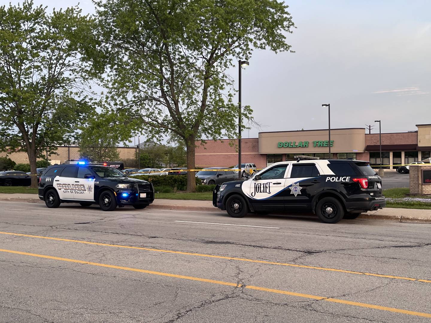 Joliet police squad vehicles near the parking lot of Dollar Tree and Osaka restaurant near the Louis Joliet Mall area on Sunday, May 3, 2026.
