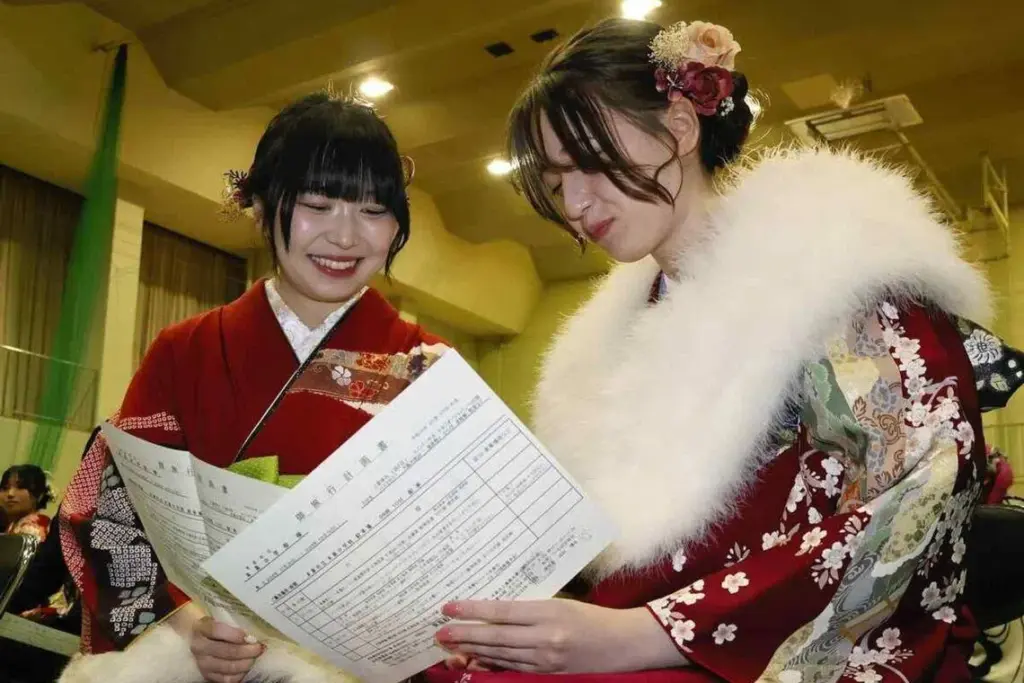 Former classmates discuss plans for their delayed school trip, after the coming-of-age ceremony in Motosu, Gifu prefecture, on Jan 11.