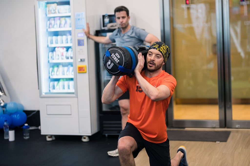 A Hyrox trainer practising weighted lunges at BFT Fitness. Photo: Handout