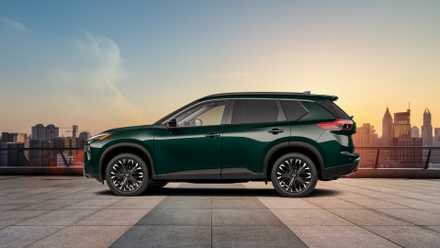 Side profile shot of a green 2026 Nissan Rogue.