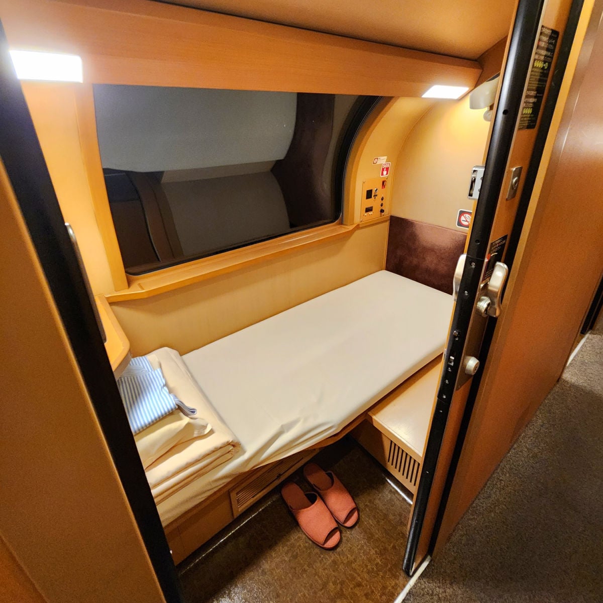 Private cabin with slippers on Japan sleeper train