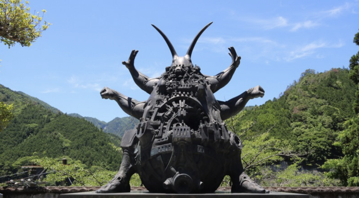 How did one small Japanese town get tourists to bug out over a giant cockroach statue? bronze statue, Gokiburiten, nara prefecture, green trees, blue sky