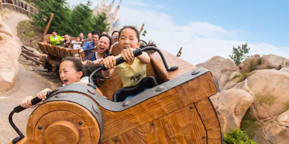 Kids ride Seven Dwarfs Mine Train at Shanghai Disneyland