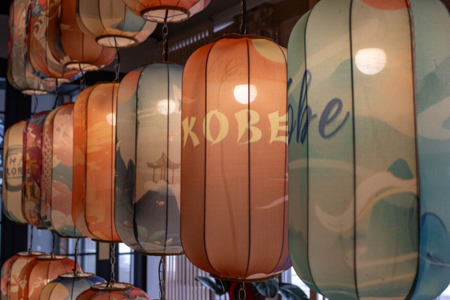 light bulbs illuminate hanging lantersn.