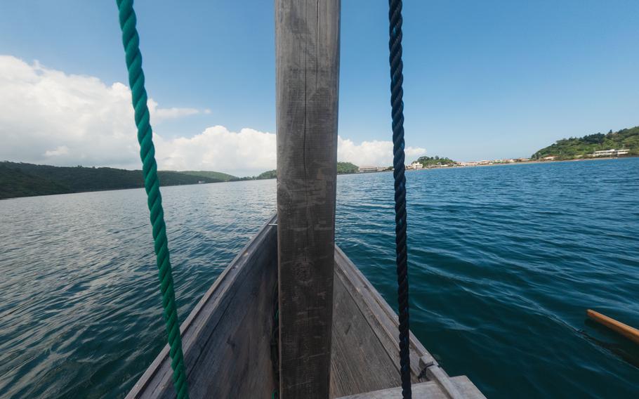 Taking a picture of the ocean from the boat.