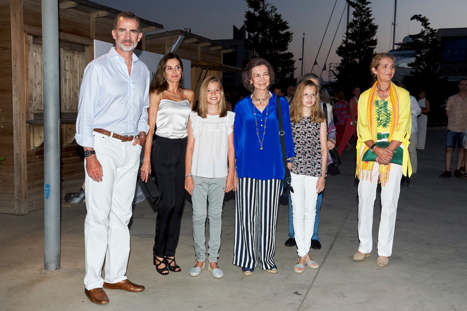 Image may contain Felipe VI of Spain Queen Sofía of Spain Clothing Pants Blouse People Person Adult and Jeans
