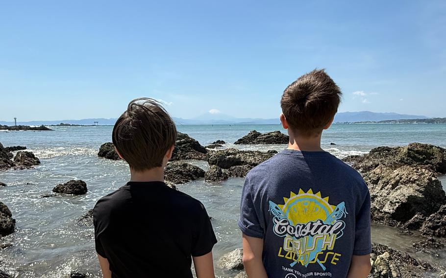 The author’s sons ake a moment to view Mt. Fuji.