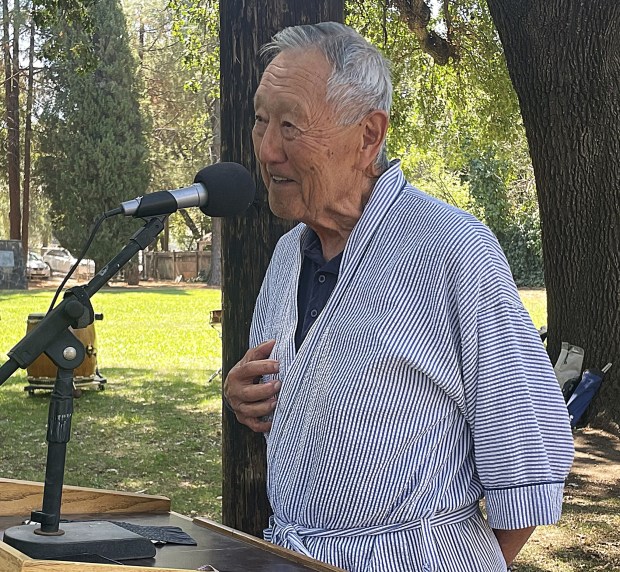John Takeuchi, a retired military pilot, shares his family's experience during World War II after Japanese Americans were forced into internment camps. (Robin Miller/The Reporter)