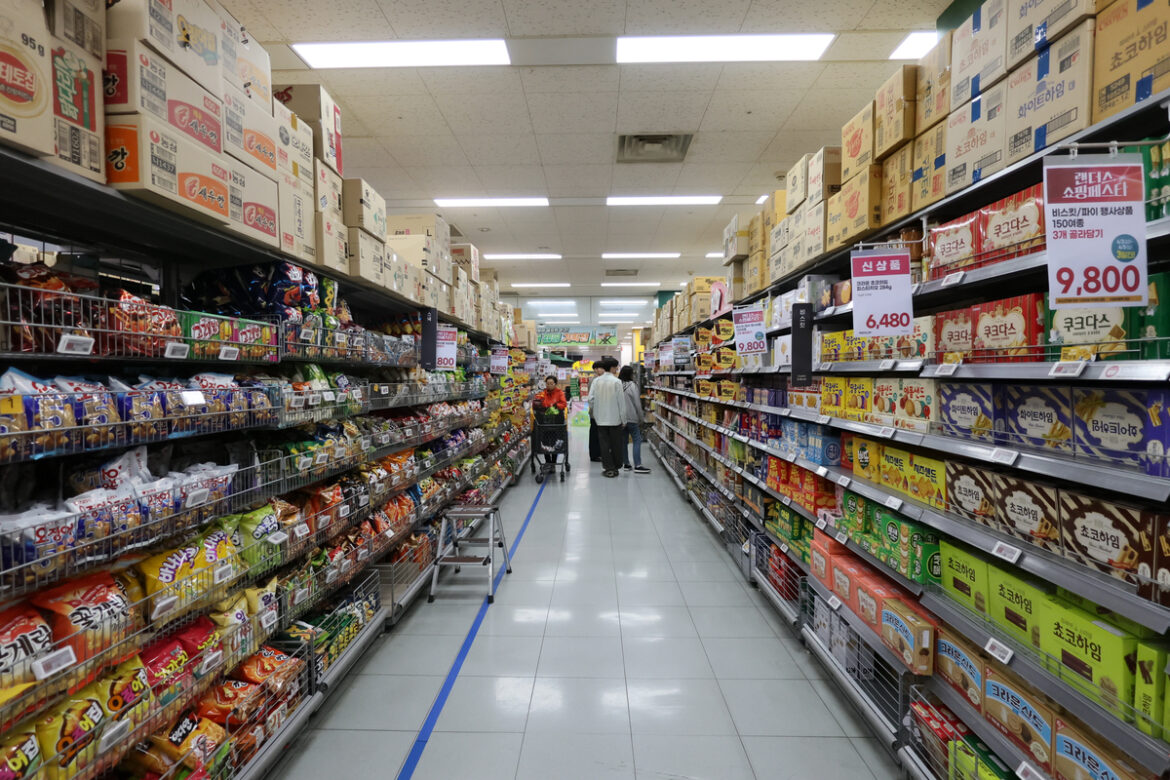 Shoppers browse snacks at a large discount store in Seoul. Yonhap News - Seoul Economic Daily Finance News from South Korea