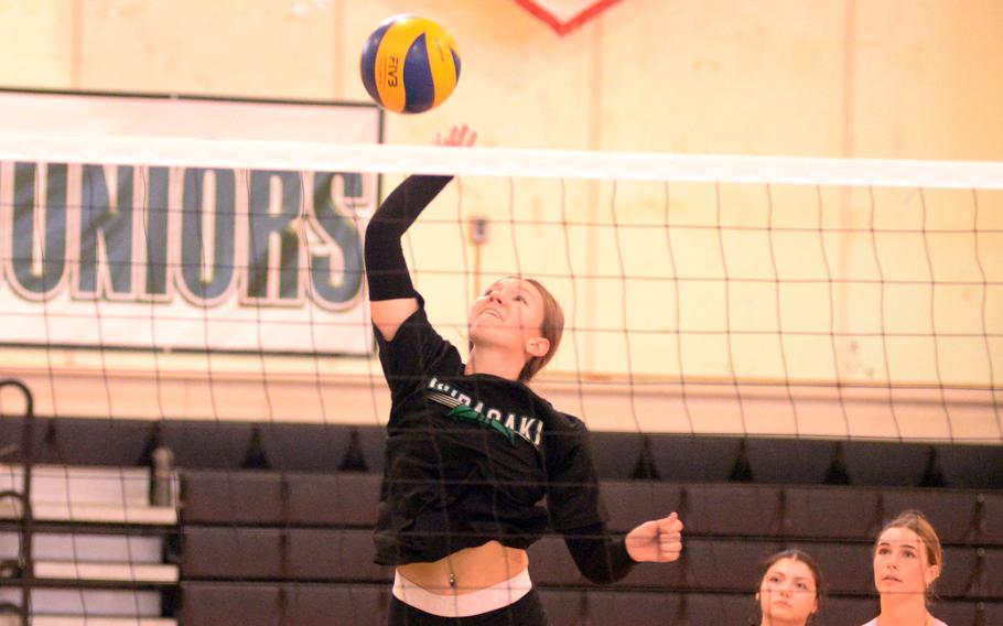 Cameron Eavers hits the ball over the net.
