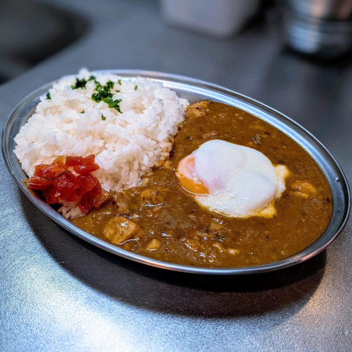 Chicken curry rice with a soft boiled egg