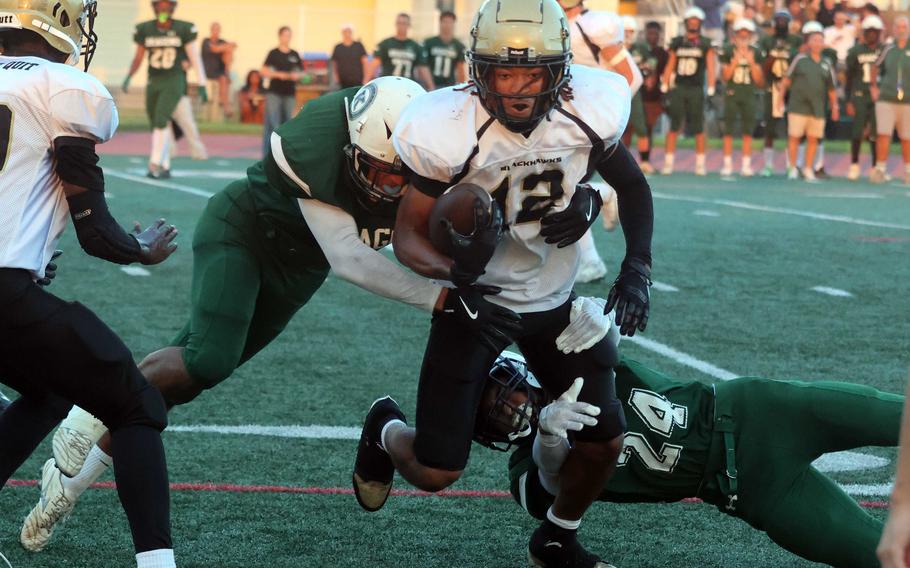 Brian Taylor carries defenders.