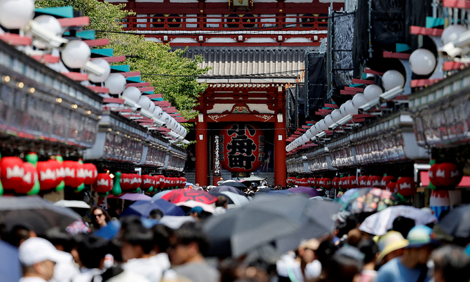 Visitors walk along Nakamise-dori Street as they visit Sensoji temple in Tokyo, Japan, August 9, 2024. Photo by Reuters