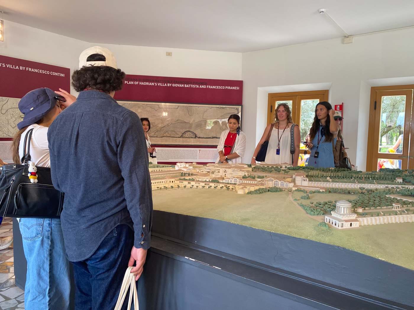 Students standing around a table with a model of Hadrian's Villa.