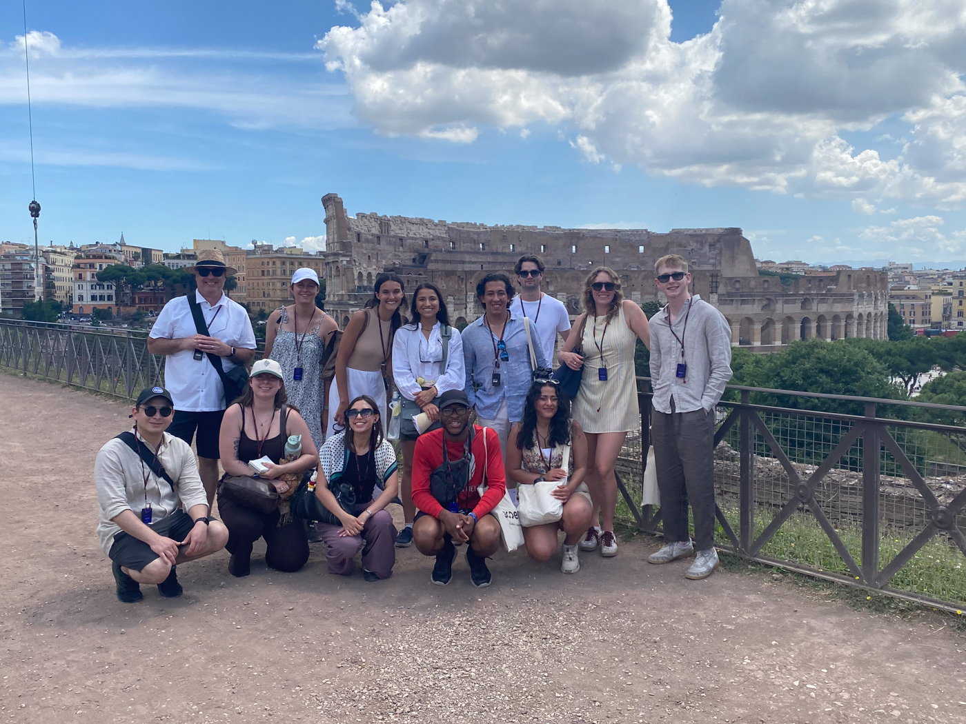 Students pose together overlooking the Coliseum in Rome.