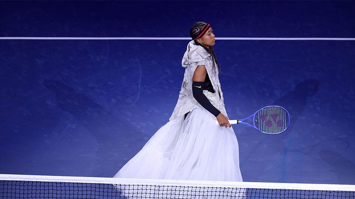 Naomi Osaka of Japan walks onto the court